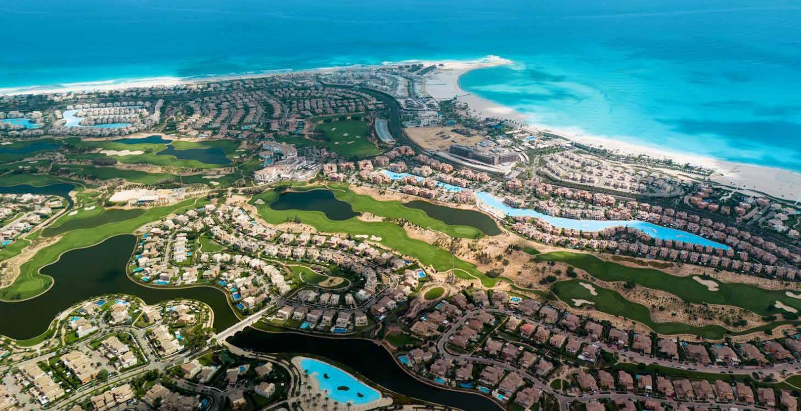 Mixed-use buildings overlooking the marina in Marassi